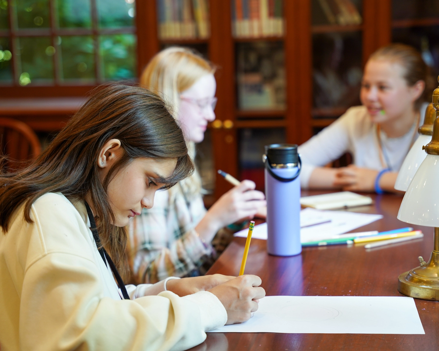 girls working at a business summer camp
