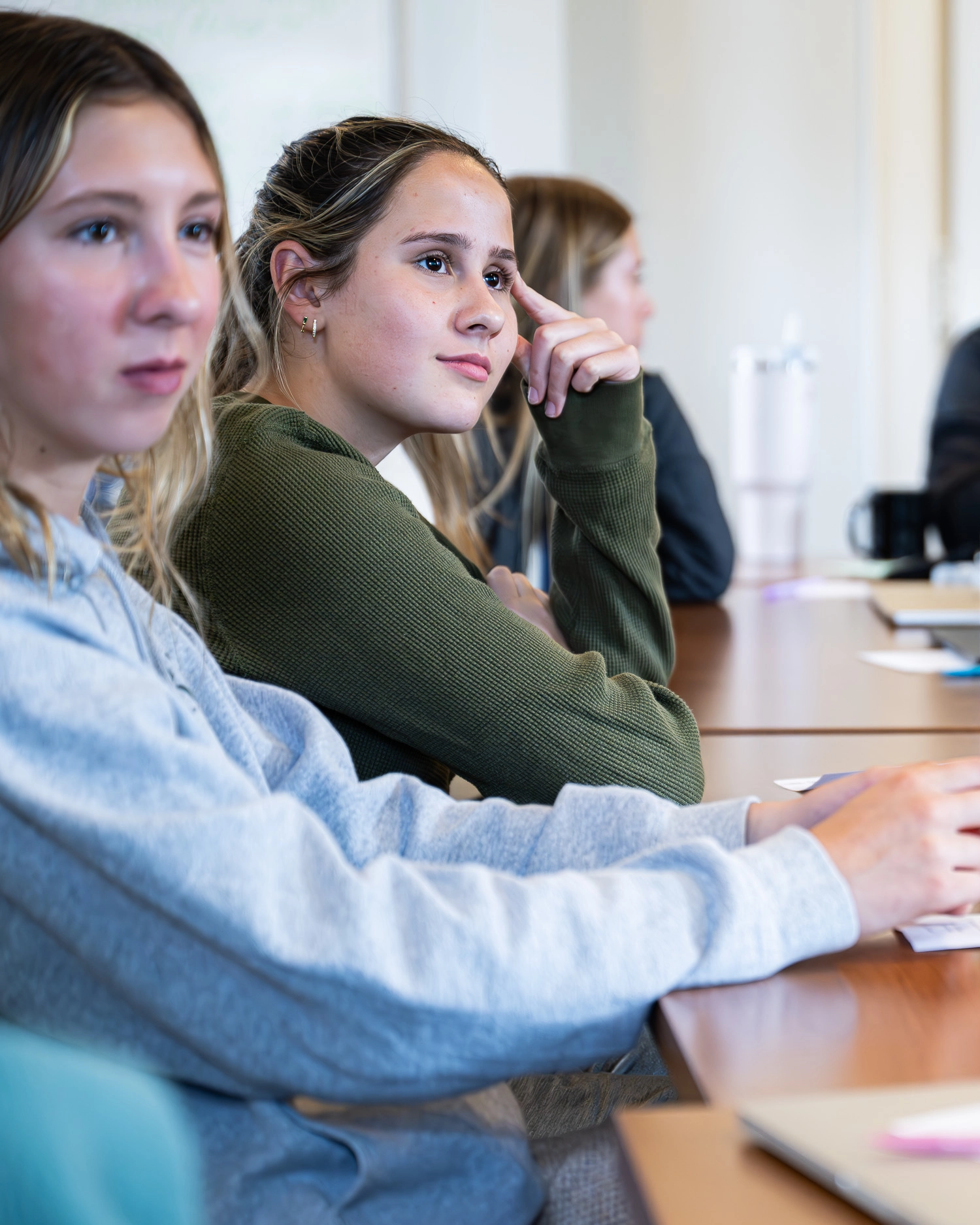 girls listening to a presentation at business summer camp