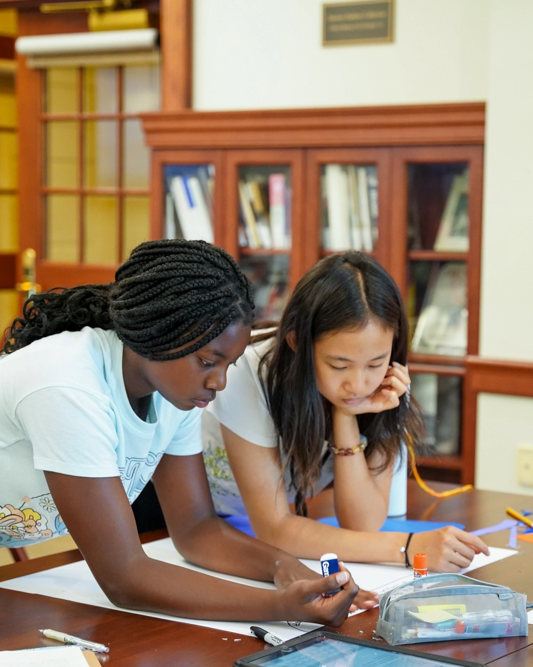 girls developing a business plan at summer camp for financial literacy
